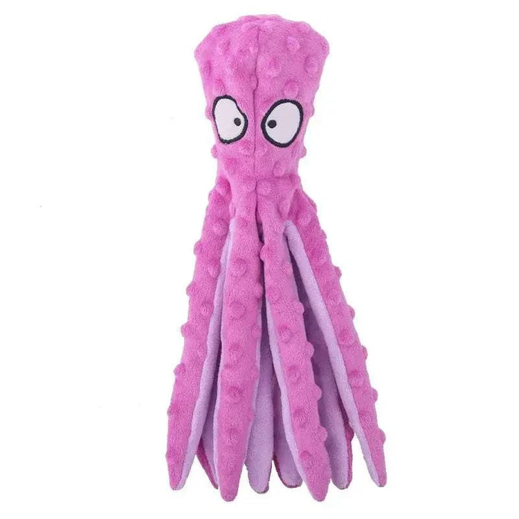 Plush Purple Octopus chew toy in bright pink-purple textured fabric, with cartoon eyes and long dangling tentacles.