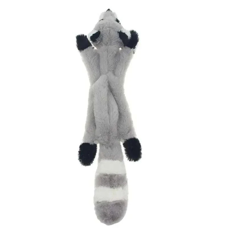 Plush Raccoon Chew Toy in soft gray and white fabric with black paws, pointed ears, and a striped tail