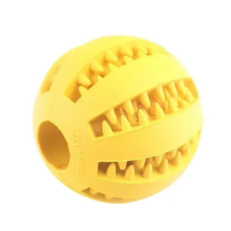 Rubber Treat Feeder in bright yellow rubber, with a round shape, ridged bands and openings lined with textured teeth